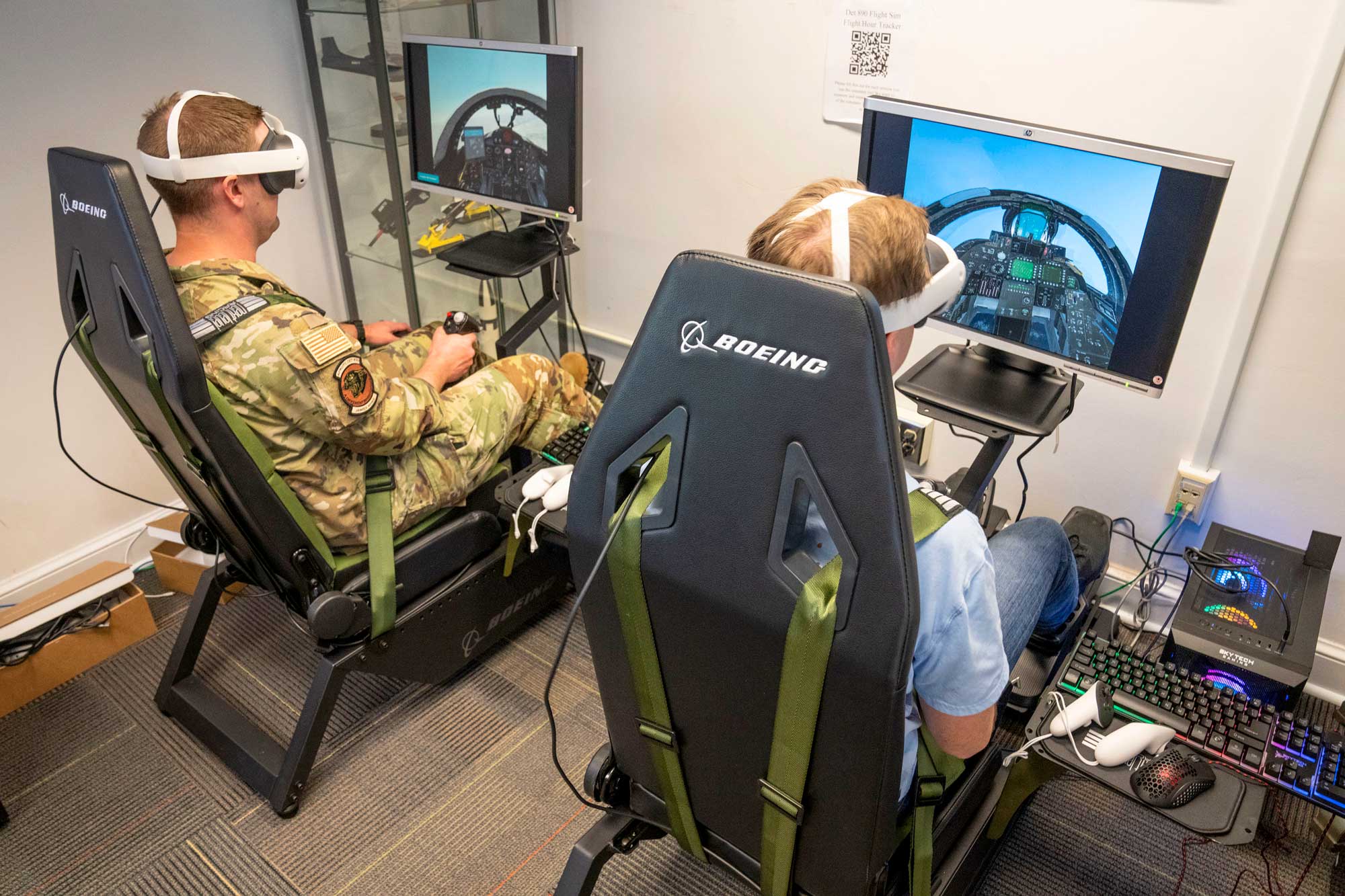 Capt. Zach Jones, left, and Air Force Cadet Jacob Lewis test the flight simulators purchased with Jefferson Trust funds. 