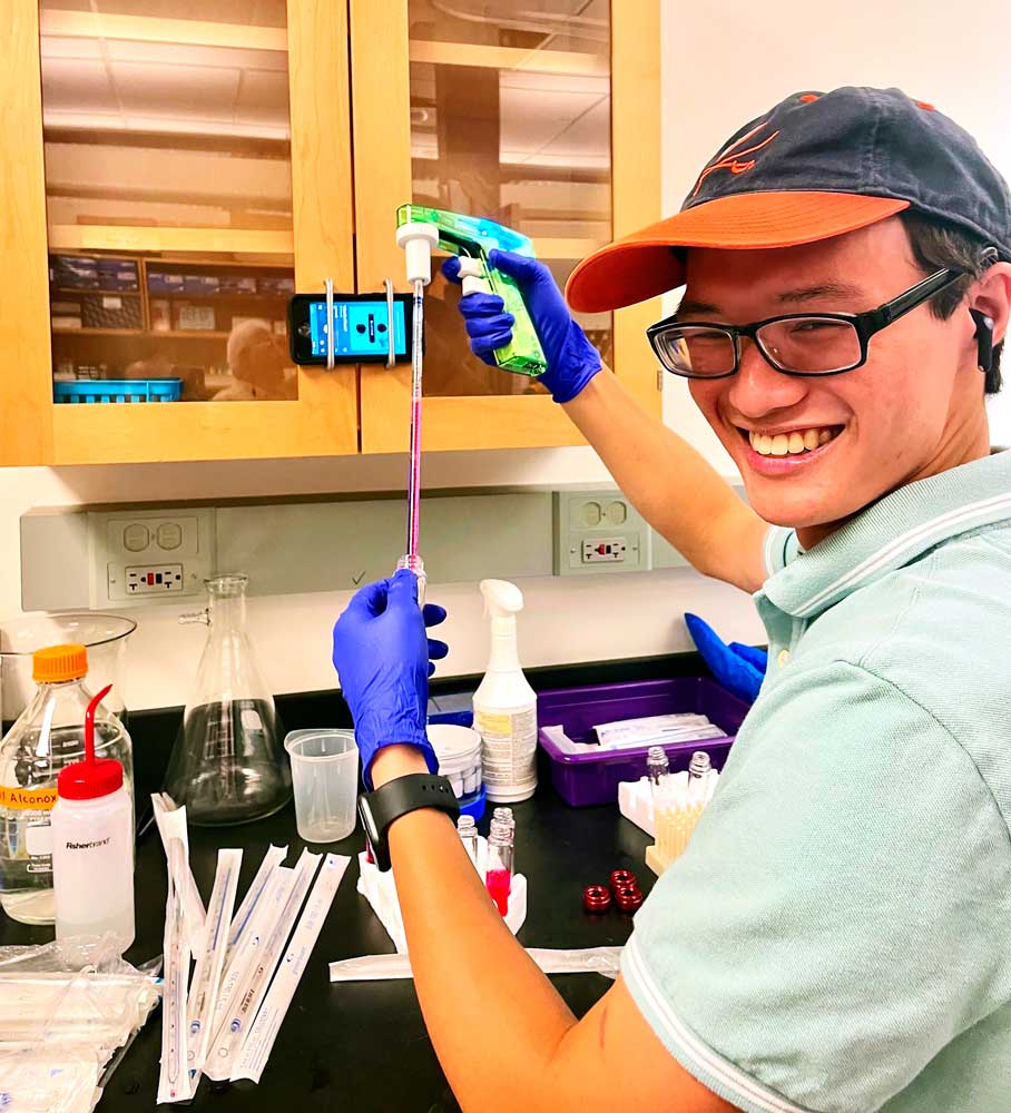 Vinh in a lab performing a test
