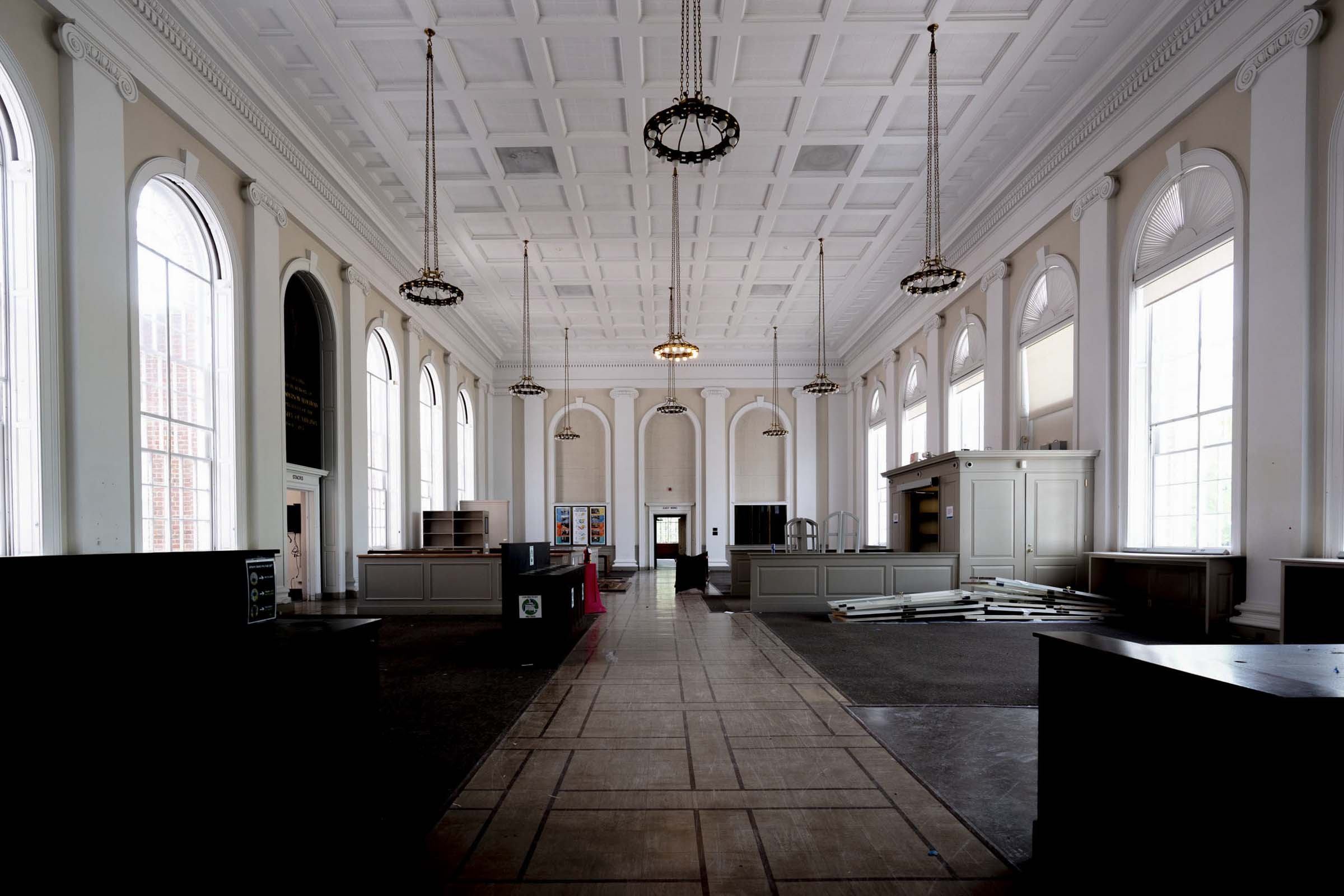 Alderman Library empty with a pile of doors next to a desk