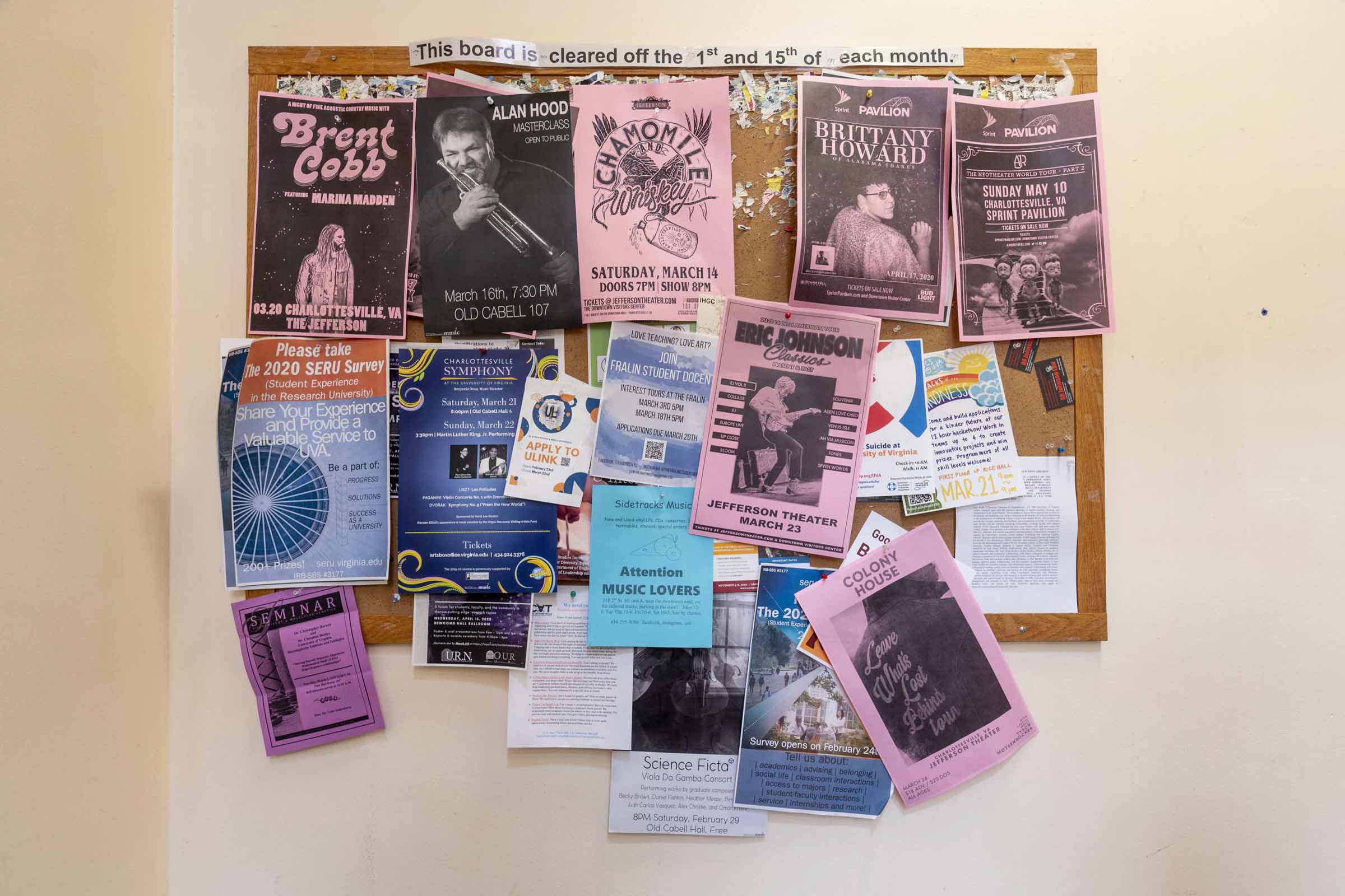 Bulletin board covered in fliers