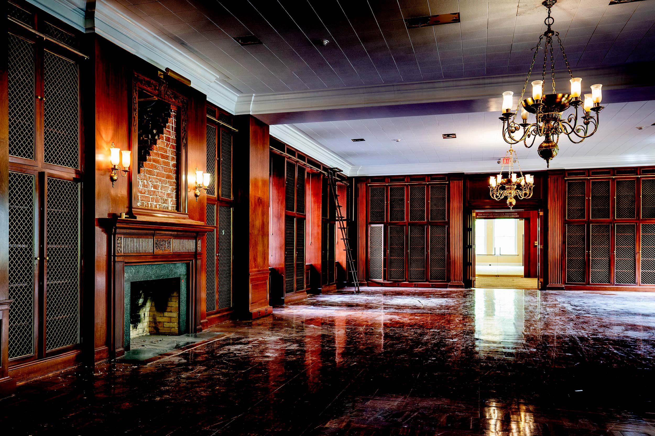 Alderman library room filled with wooden bookshelves with dust and dirt all over the wooden floors