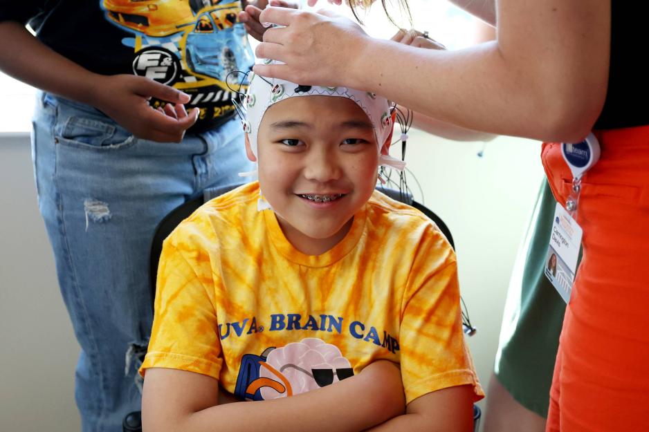 A child wearing an EEG cap to track activity in the brain