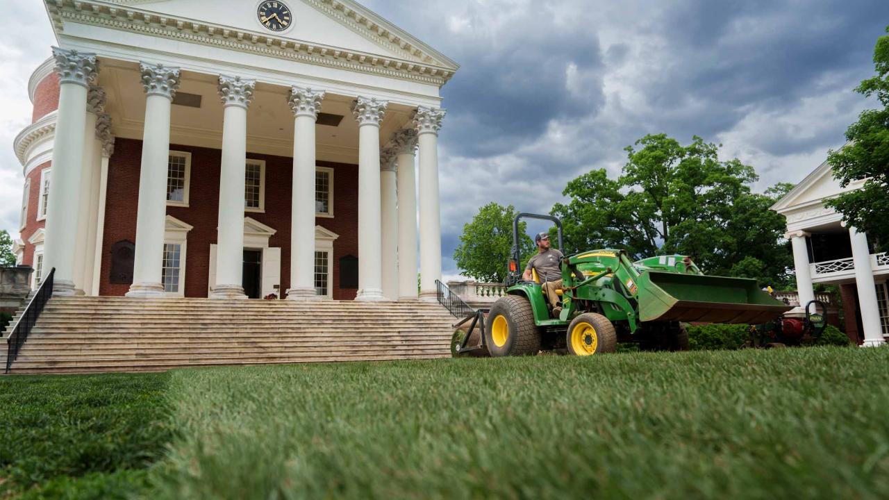 Image of the Rotunda shot from the lawn with a John Deere tracker in the frame